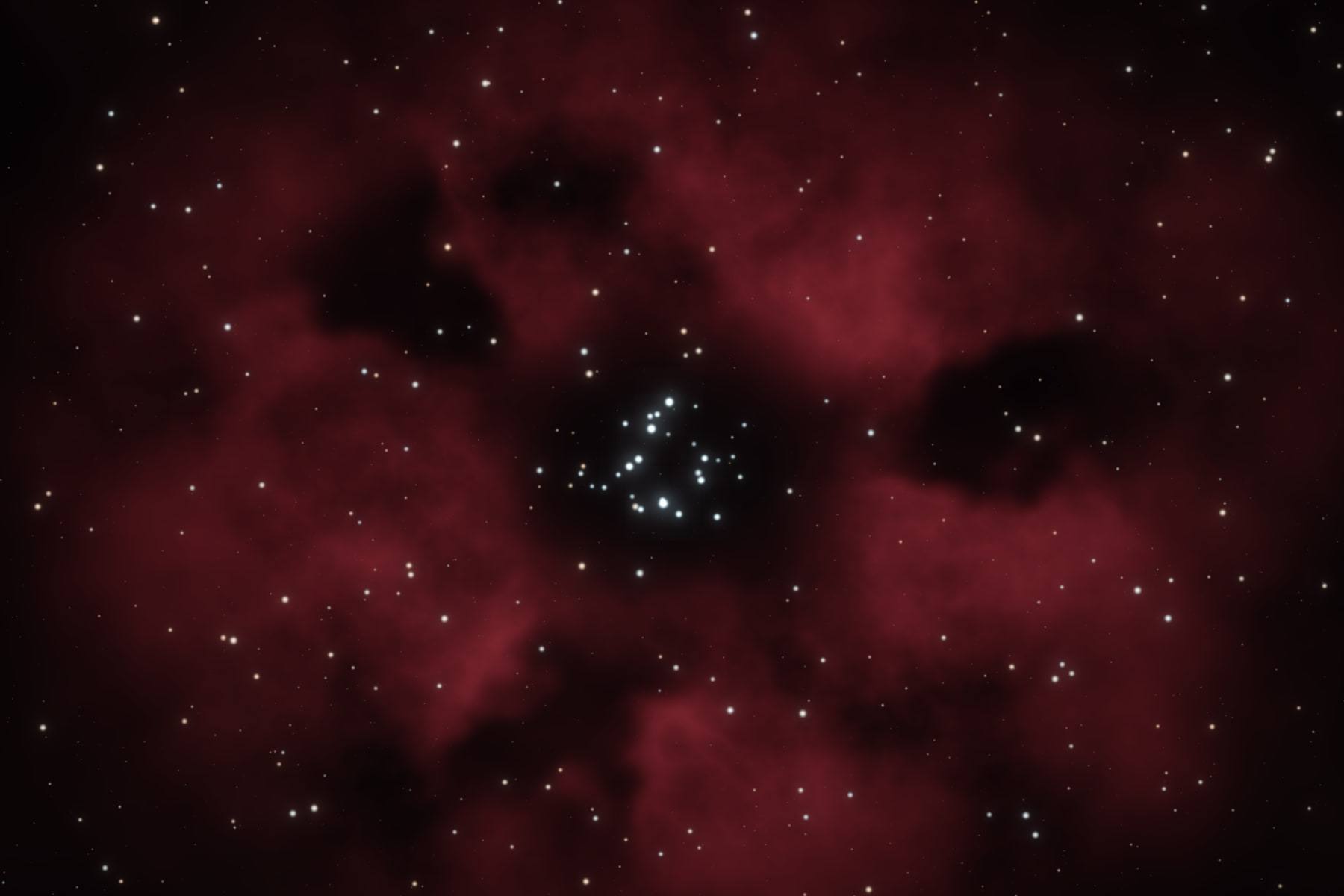 Glowing red gas and dark dust around the small star cluster at the core of the Heart Nebula.