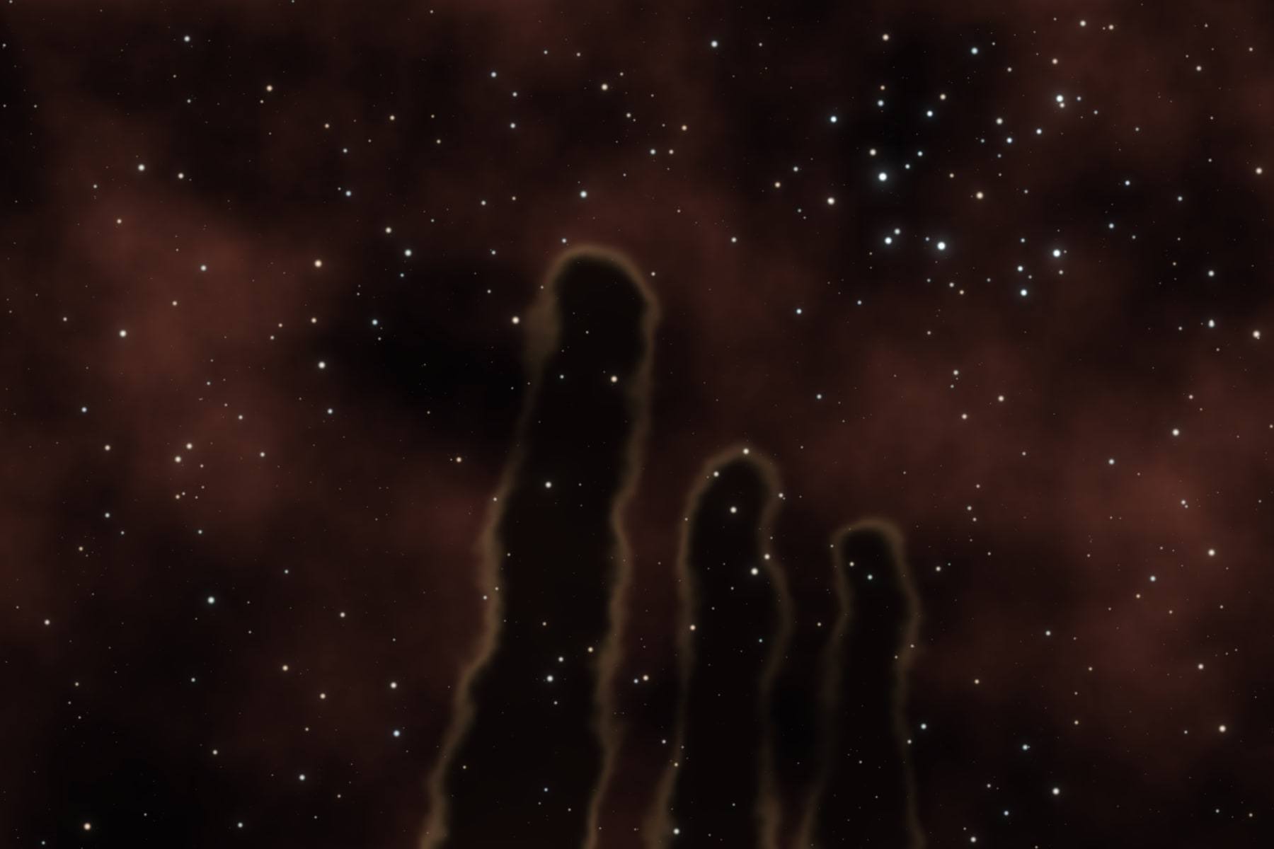 The Eagle Nebula, with dark columns of dust rising into glowing gas.