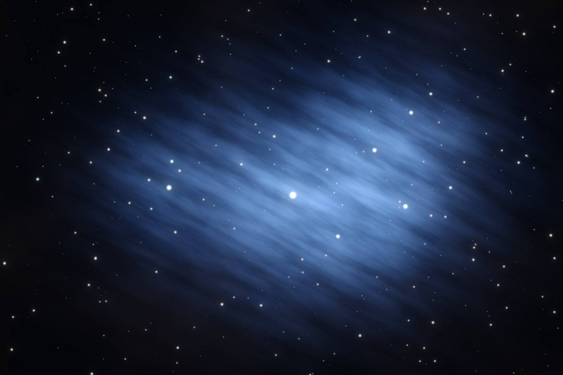 The Pleiades star cluster, a knot of bright blue stars wrapped in wisps of blue dust.